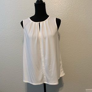 Cream sleeveless blouse